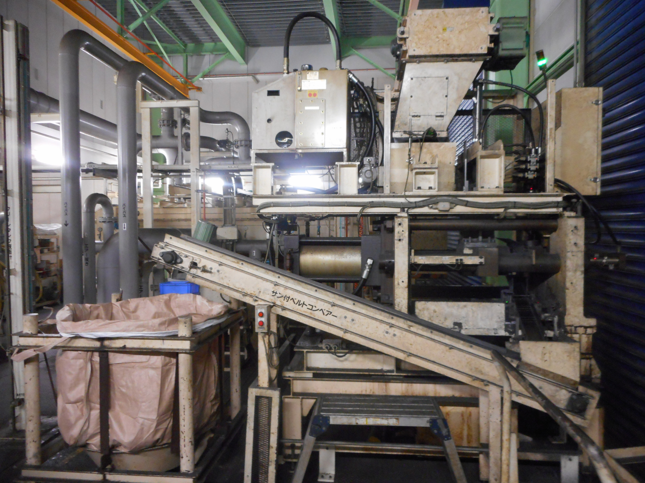 Grinding sludge solidification equipment (Kuwana Works)