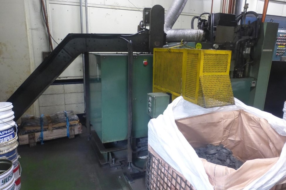Grinding sludge solidification equipment (Iwata Works)