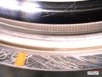 Photo:Raceway surface of outer ring after electrical pitting(standard product)