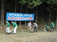 Photo: Planting azaleas on the side of the road as part of the planting ceremony (November 28)