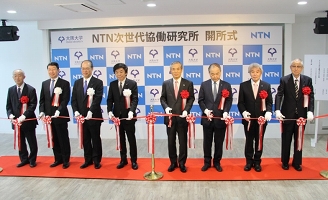 Eight members from Osaka University and NTN cutting the ribbon