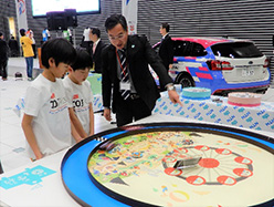 TOJ kids receiving explanations of programs of &ldquo;NTN Rotating School&rdquo;